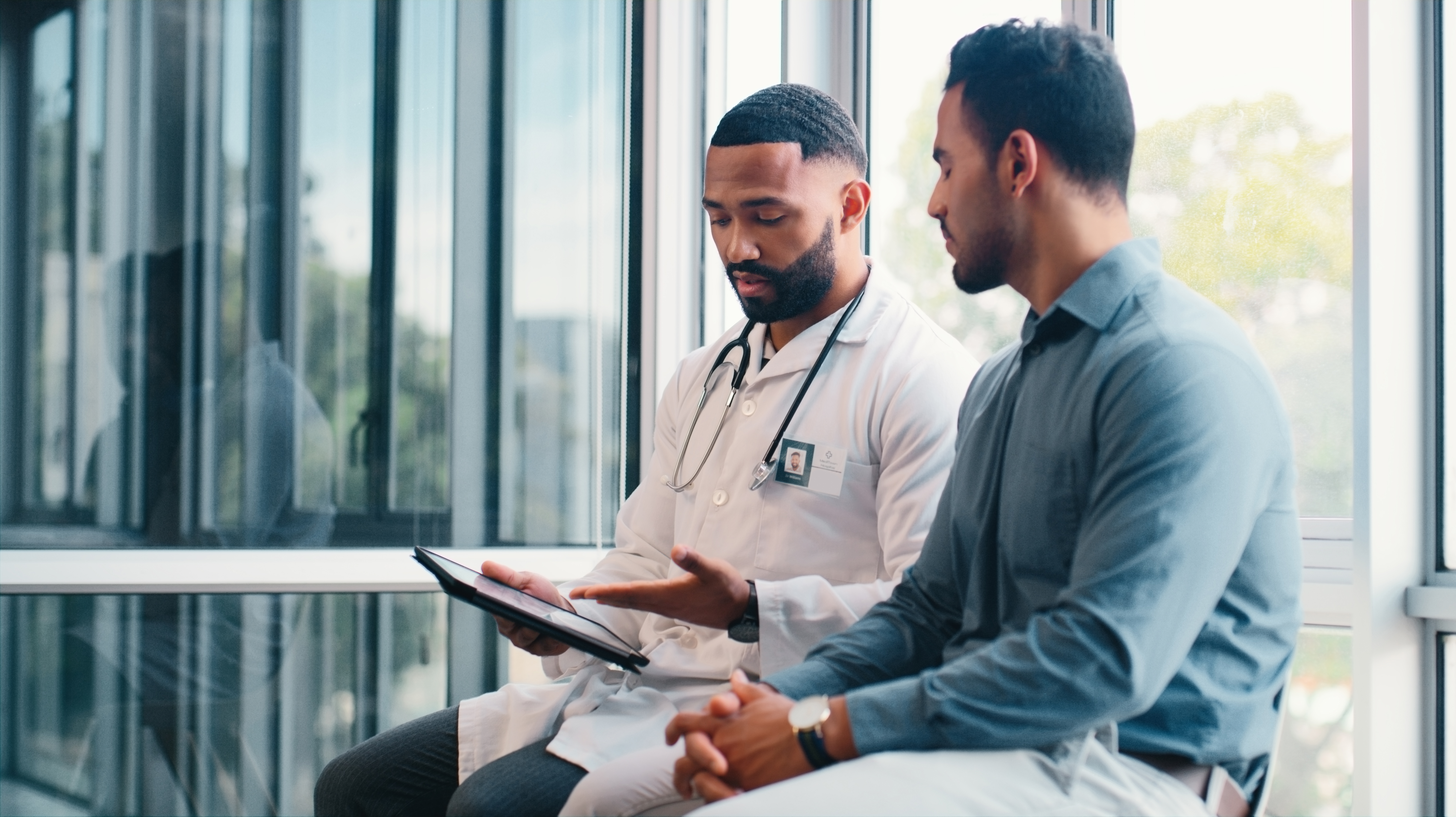 An image of a physician and patient.